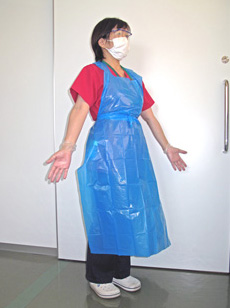 青色ガウンを着た訪問看護師の画像